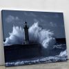 Stormy waves over old lighthouse Canvas Print or Poster
